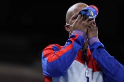 体育直播-举重比赛中古巴选手霸气夺冠